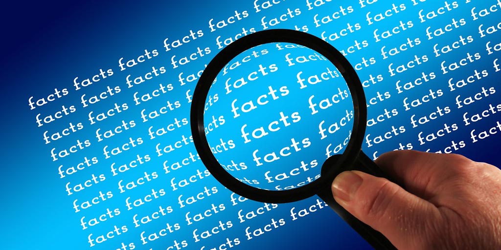 Magnifying glass over the word 'facts' repeated.