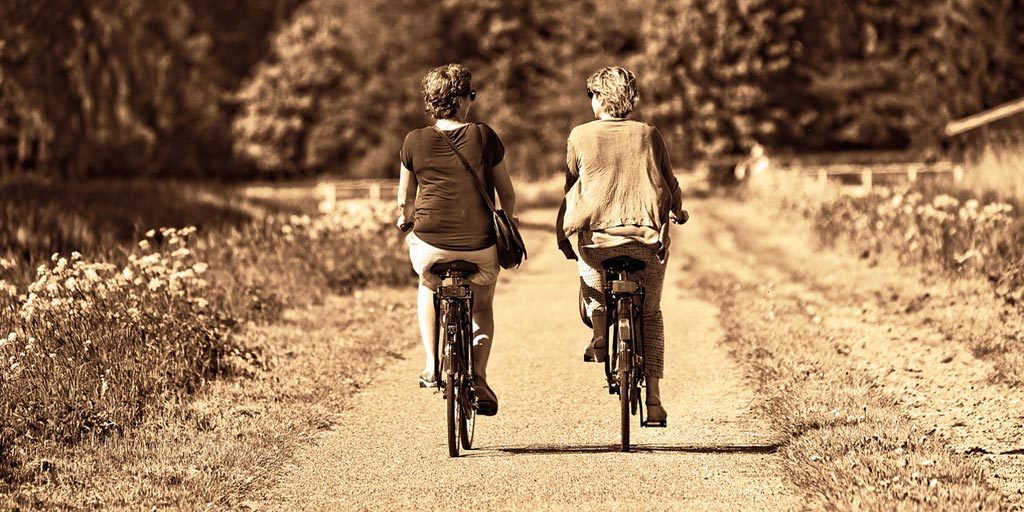 Two people cycling